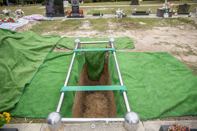 Closeup shot of a funeral casket or coffin in a hearse or chapel or burial at cemetery
