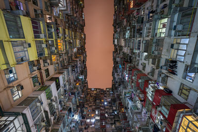 High angle view of illuminated buildings against sky at night