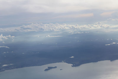 Aerial view of snowcapped mountains against sky