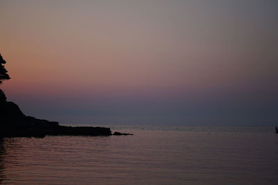 Scenic view of sea against sky at sunset