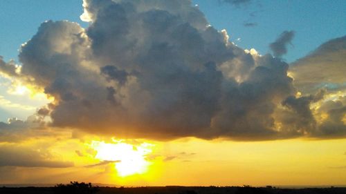 Low angle view of dramatic sky during sunset