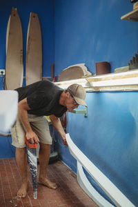 Man working in blue water