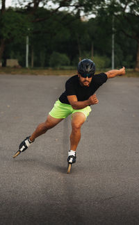 Full length of man running on road