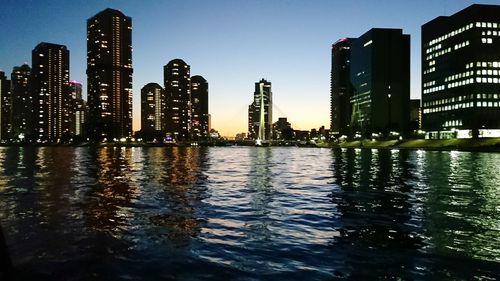 View of skyscrapers lit up at night