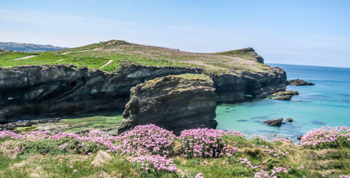 Scenic view of sea and rocks against sky