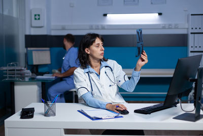 Portrait of female doctor working in laboratory