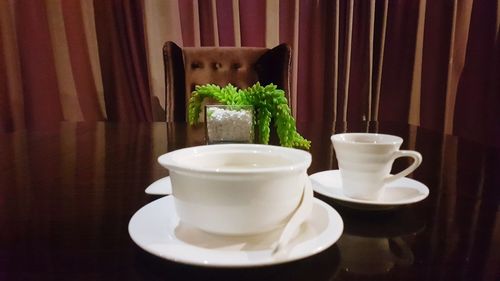 Close-up of coffee cup on table