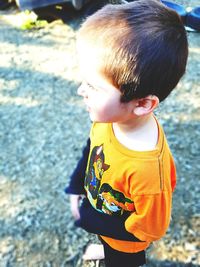 High angle view of boy standing outdoors