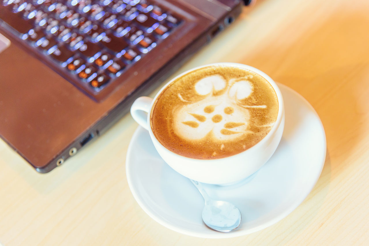 HIGH ANGLE VIEW OF COFFEE ON TABLE AT HOME