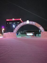 Illuminated bridge at night during winter