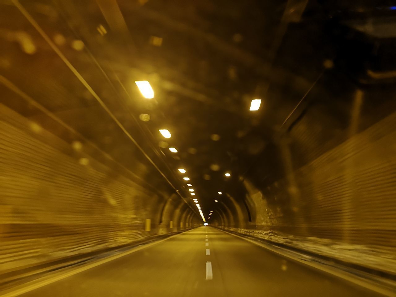 EMPTY ROAD IN TUNNEL