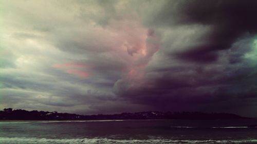 Scenic view of sea against cloudy sky