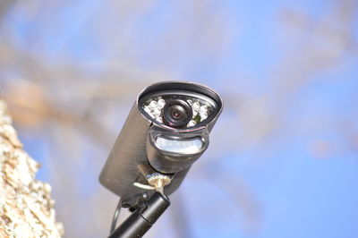 High angle view of coin-operated binoculars against sky