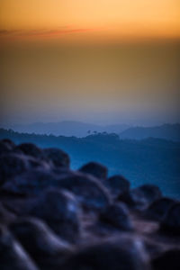 Close-up of sea against sky during sunset