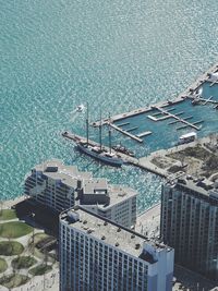 High angle view of buildings by sea