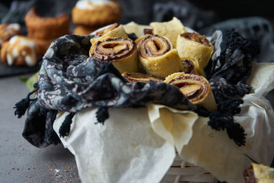 Cake in chocolate rolls with sugar