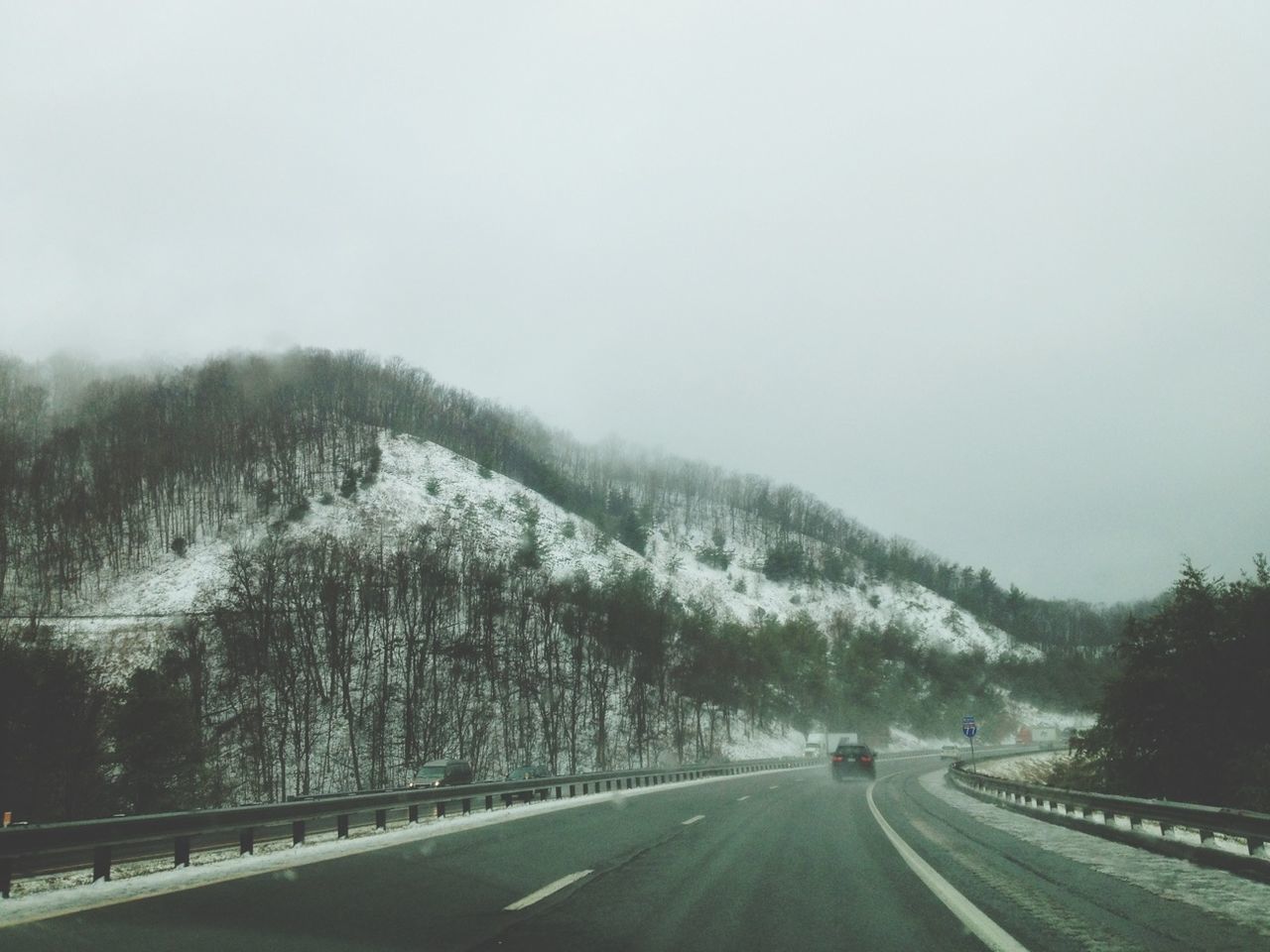 road, transportation, the way forward, diminishing perspective, road marking, tree, weather, winter, country road, snow, mountain, clear sky, vanishing point, tranquility, nature, tranquil scene, cold temperature, beauty in nature, copy space