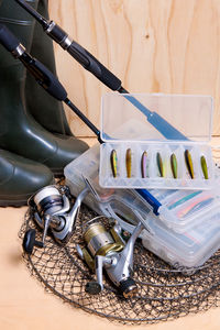 Close-up of fishing equipment on table