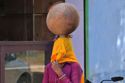 Indian lady carrying water pot on her head