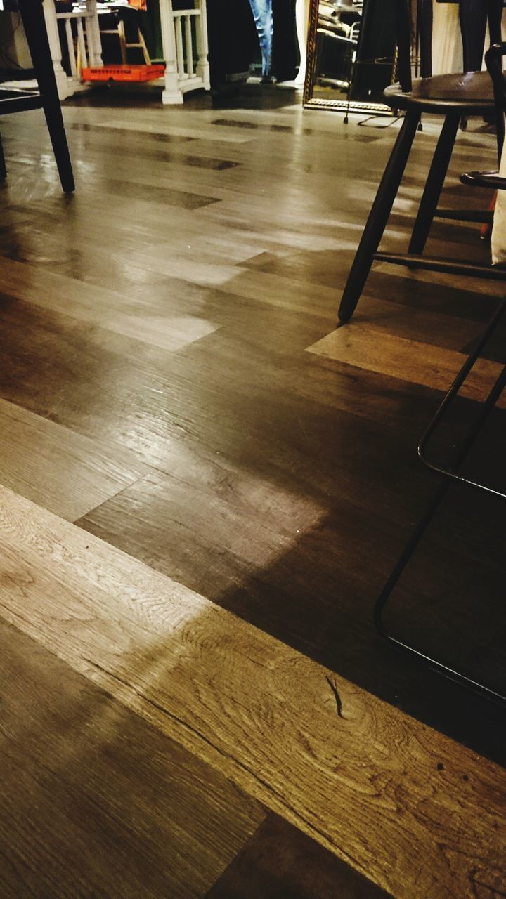 indoors, high angle view, wood - material, flooring, empty, absence, table, built structure, architecture, shadow, no people, chair, sunlight, house, floor, hardwood floor, door, home interior, day, wooden