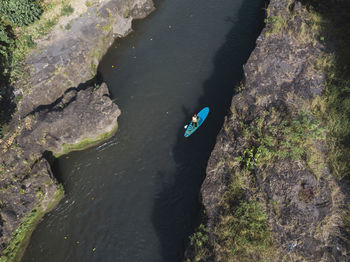 Man paddle boarding the river