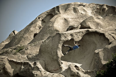 Woman standing on rock formation