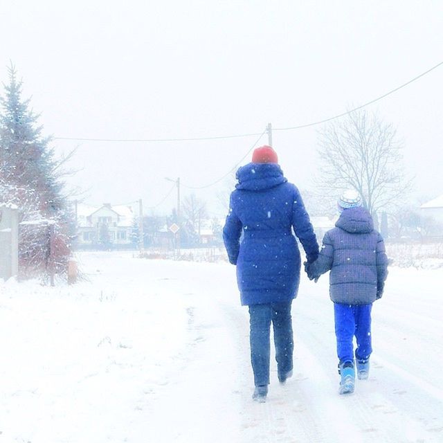 winter, cold temperature, snow, season, weather, lifestyles, warm clothing, rear view, walking, full length, leisure activity, men, covering, standing, frozen, clear sky, umbrella, street