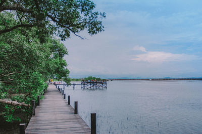 Pier over sea against sky