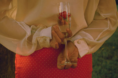 Midsection of woman holding ice cream