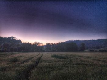 Scenic view of field against sky during sunset