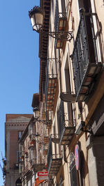 Low angle view of buildings against clear sky