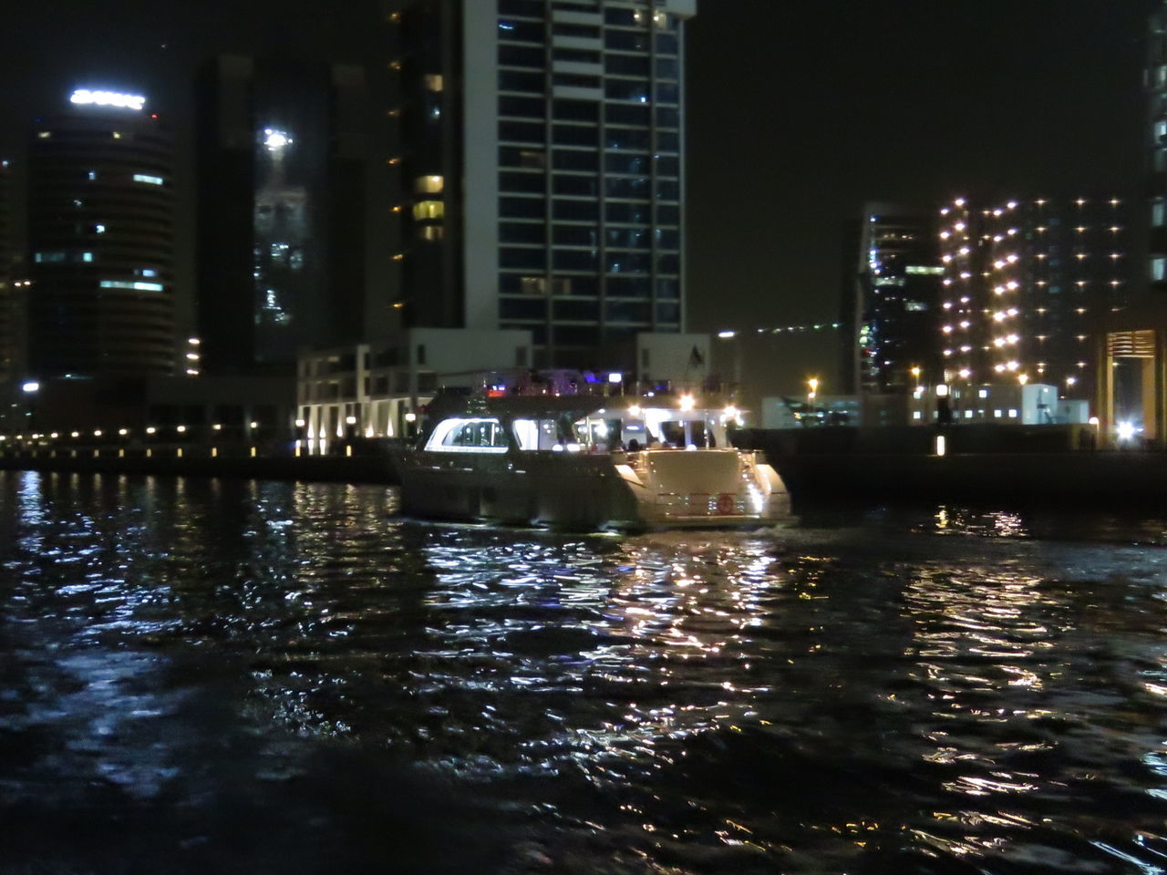 VIEW OF ILLUMINATED CITYSCAPE