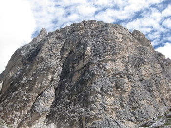 Low angle view of rock formation against sky