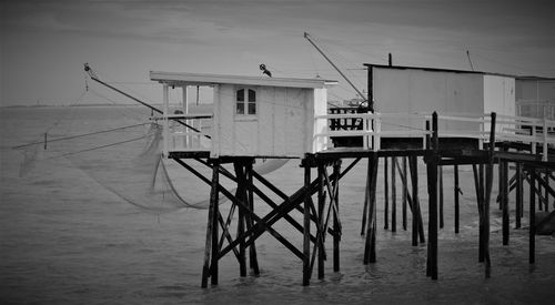 Lifeguard hut on beach against sky