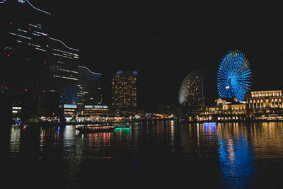 Illuminated buildings in city at night