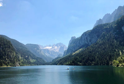 Scenic view of lake and mountains against sky