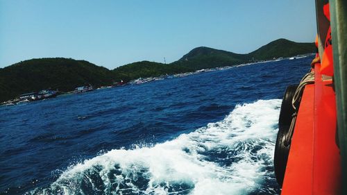 Scenic view of sea against clear blue sky