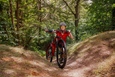 Rear view of man riding bicycle