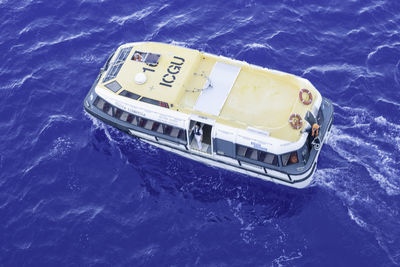 High angle view of ship sailing in sea