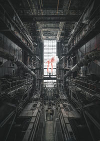 Digital composite image of people working in factory