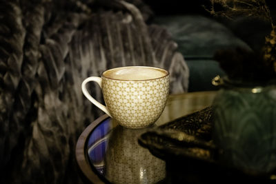 Close-up of coffee cup on table