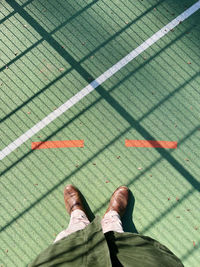 Low section of man standing on floor