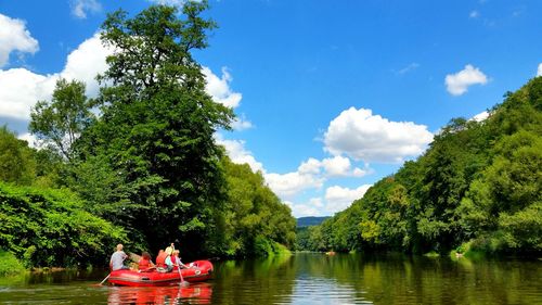 People rafting on river