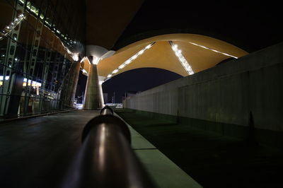 Surface level of illuminated bridge at night