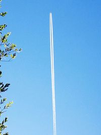 Low angle view of vapor trail against clear sky