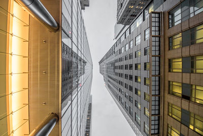 Low angle view of tall buildings against sky