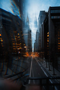 City street and buildings seen through windshield