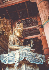 Low angle view of statue of historic building