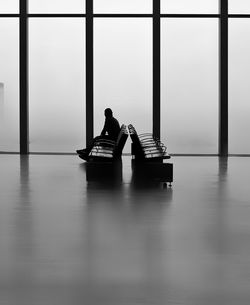 Men sitting on table in building