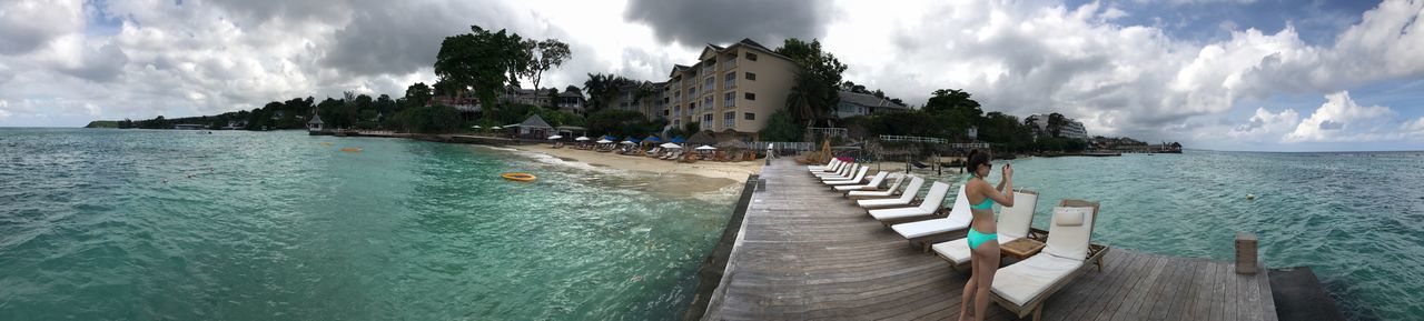 cloud - sky, sky, water, nature, tree, scenics, sea, beauty in nature, day, outdoors, tranquil scene, panoramic, tranquility, palm tree, jetty, built structure, travel destinations, vacations, fish-eye lens, architecture, no people